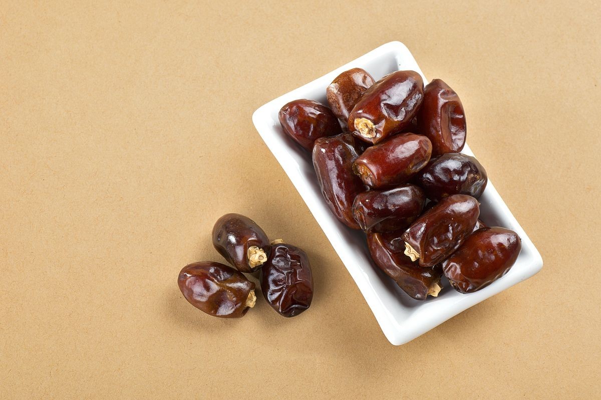 Dates in plate. Dried dates fruits.
